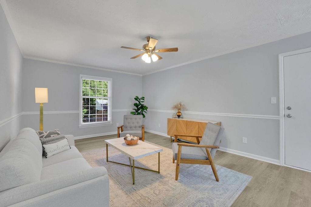 a living room with furniture and a window