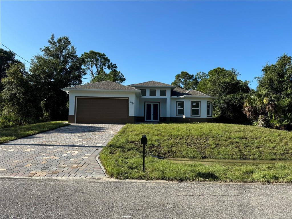 front view of a house with a yard