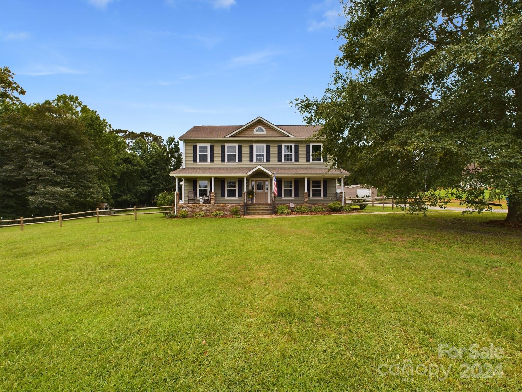 a view of a house with a big yard