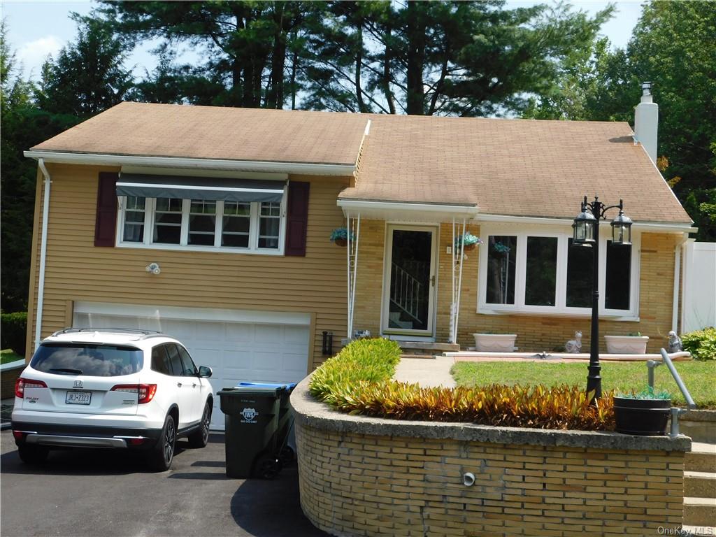 a front view of a house with sitting space