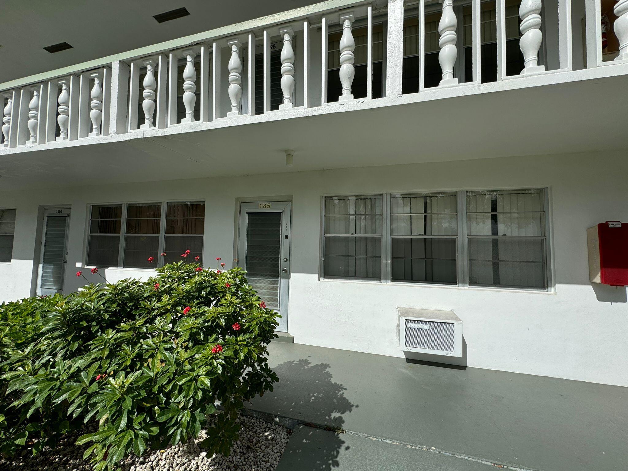 a view of a house with a small yard