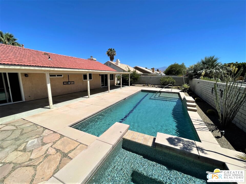 a view of a house with swimming pool