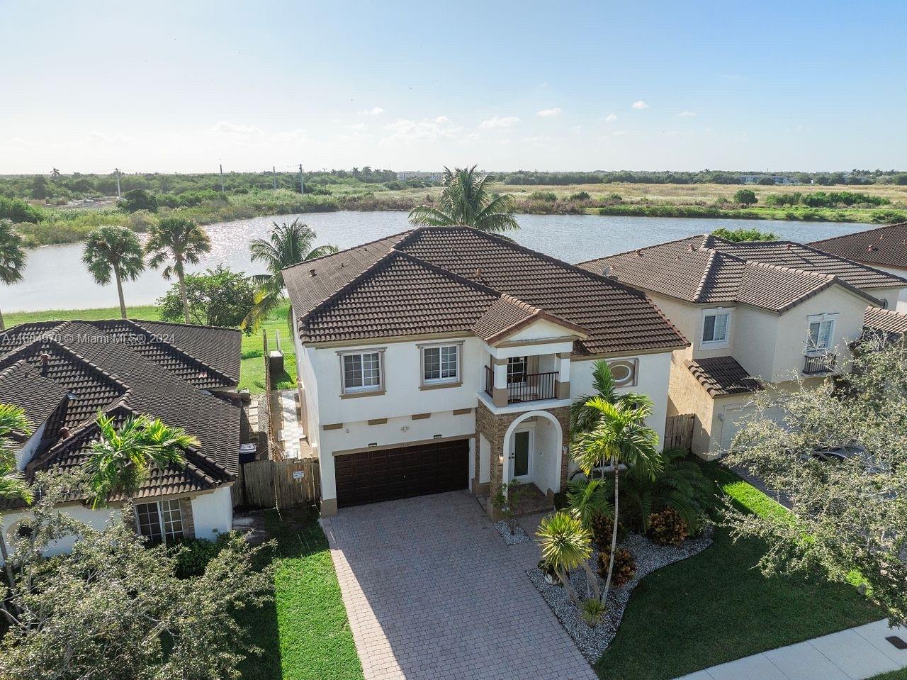 an aerial view of a house with a garden view