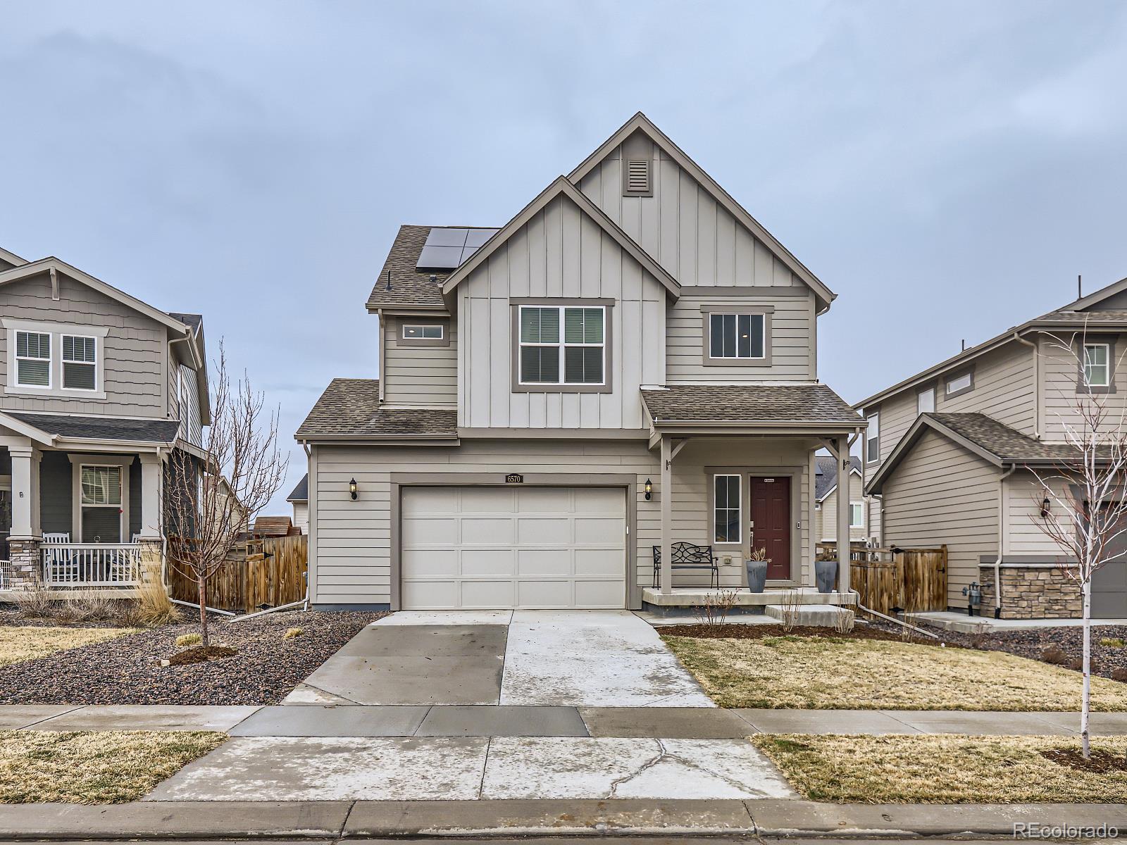 a front view of a house with garage