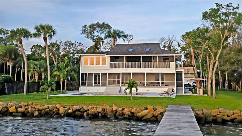 front view of a house with a swimming pool