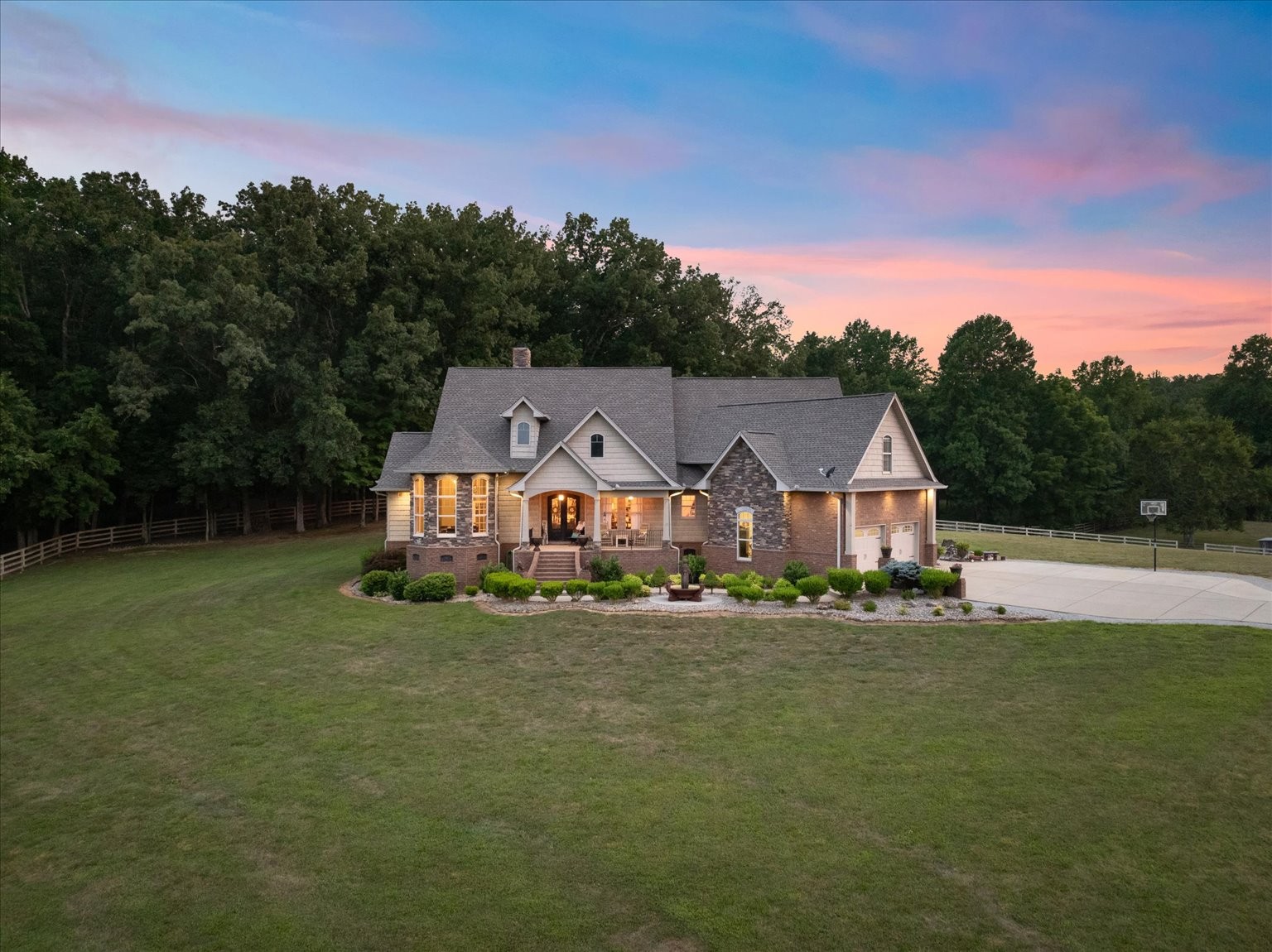 a front view of a house with a big yard