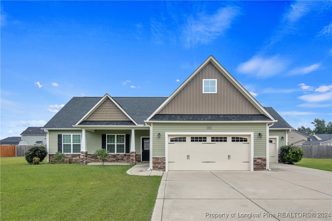 a front view of a house with yard porch and seating area