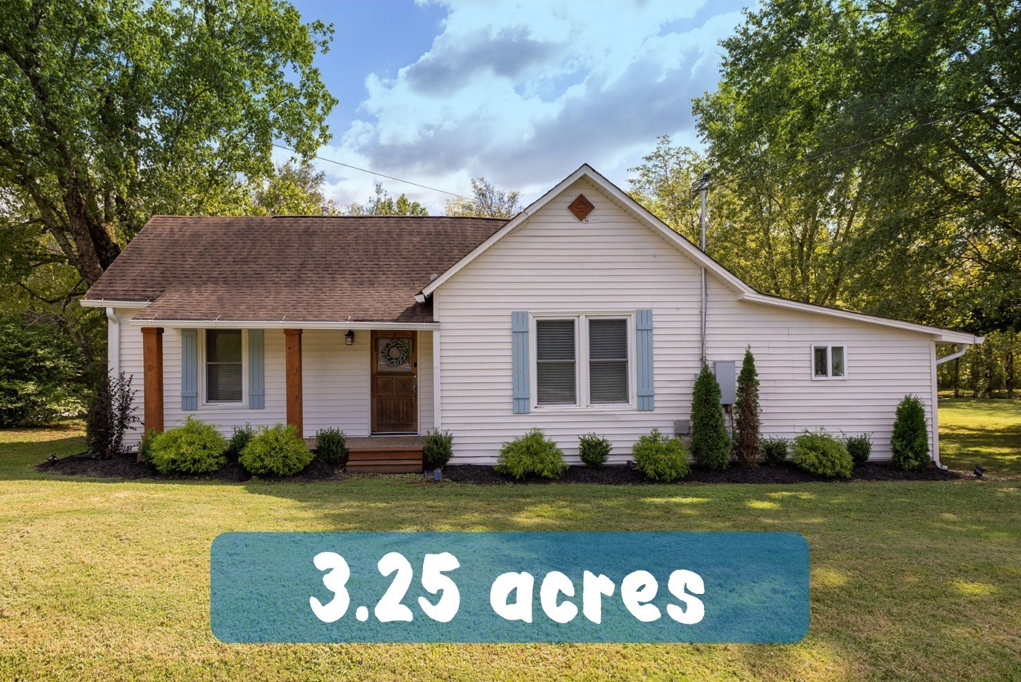 a front view of house with yard outdoor seating and green space