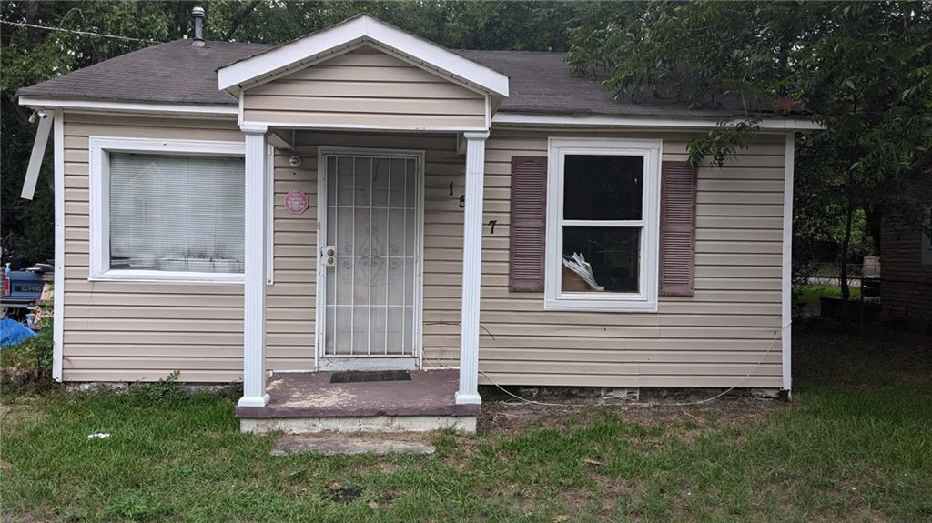 a front view of a house with a yard