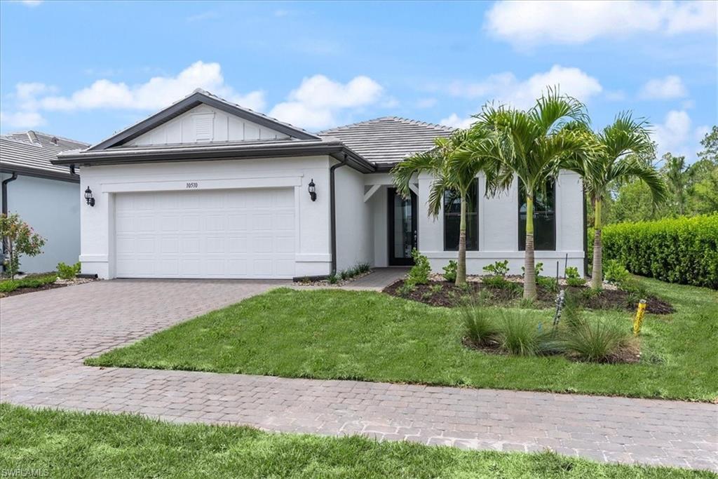 a front view of house with yard and green space