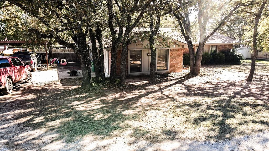 a view of a backyard of the house