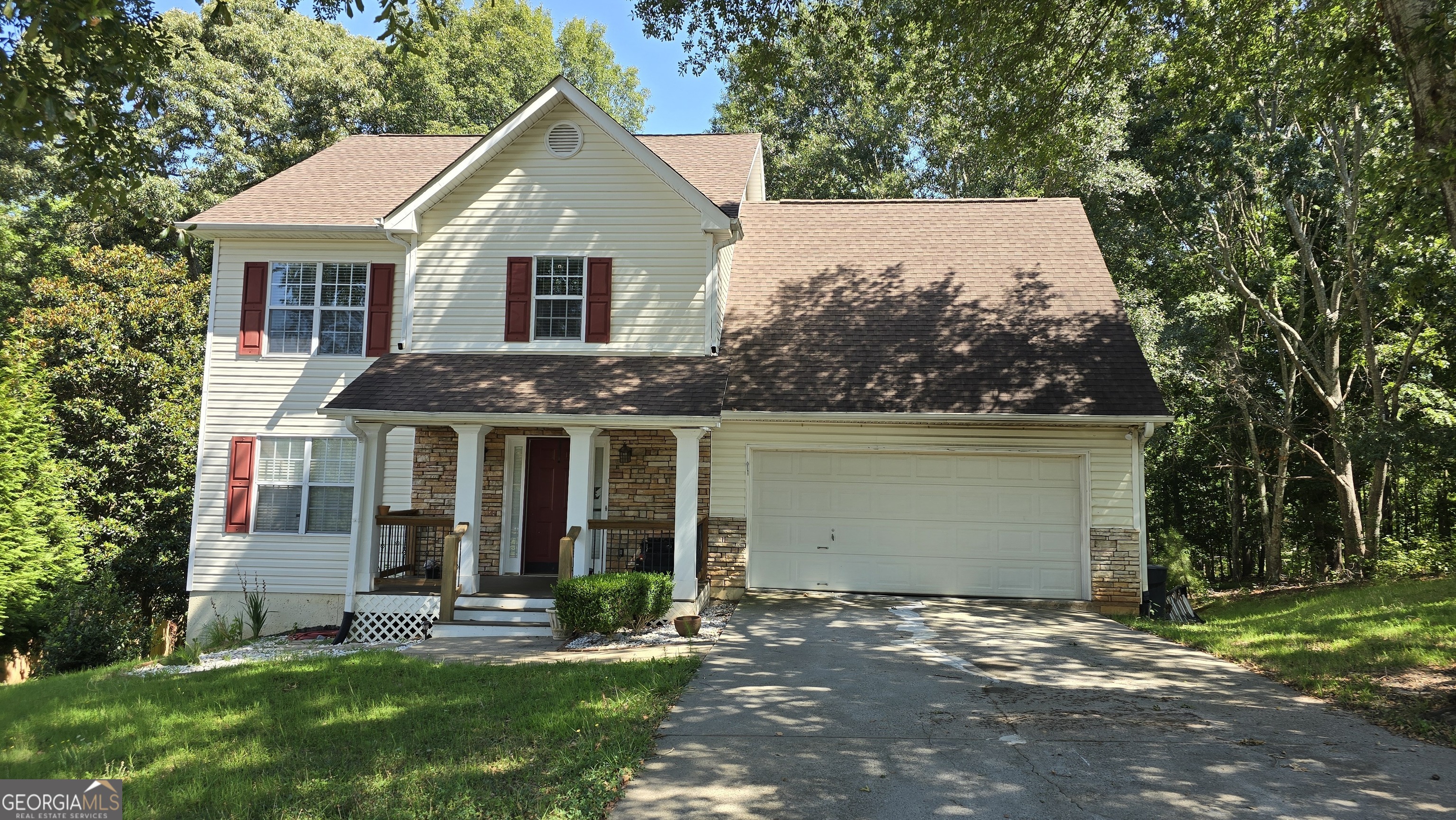 front view of a house with a yard