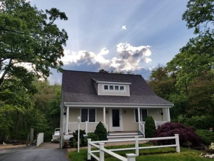 a front view of a house with a yard