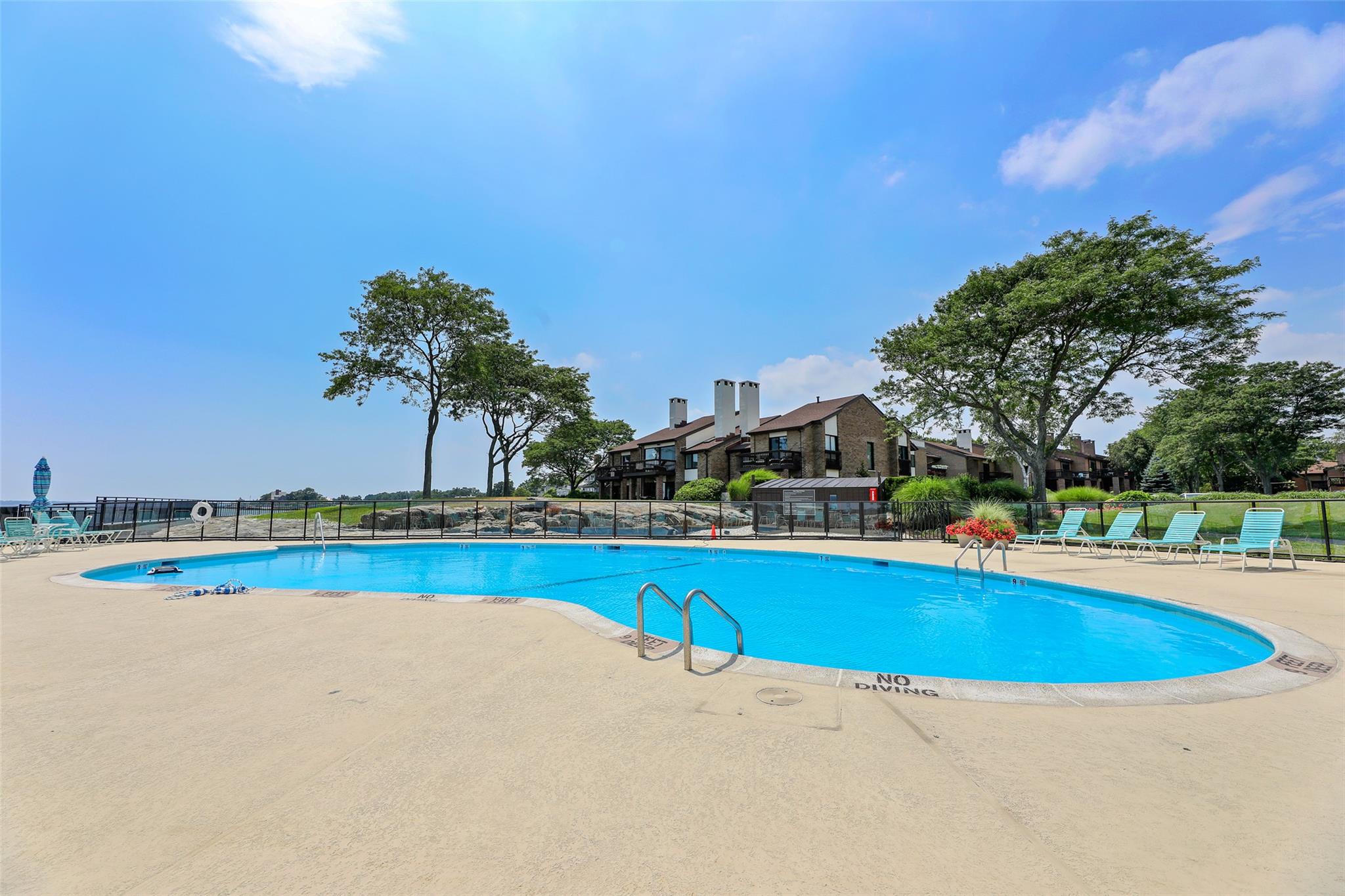 a view of a swimming pool and an outdoor space