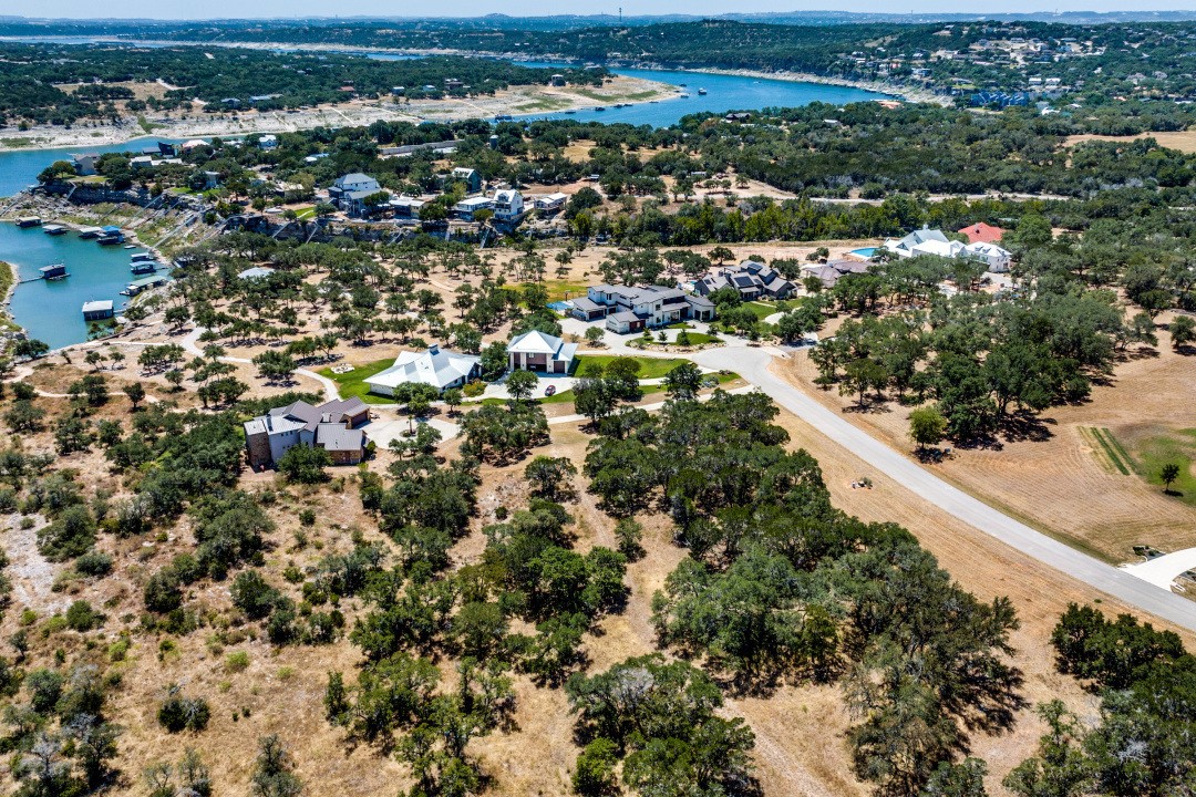 an aerial view of residential houses with outdoor space