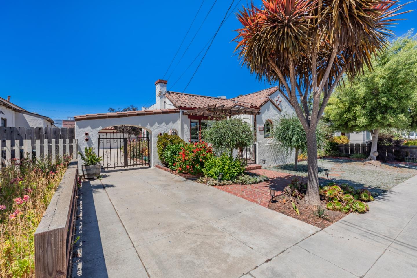 a front view of a house with garden