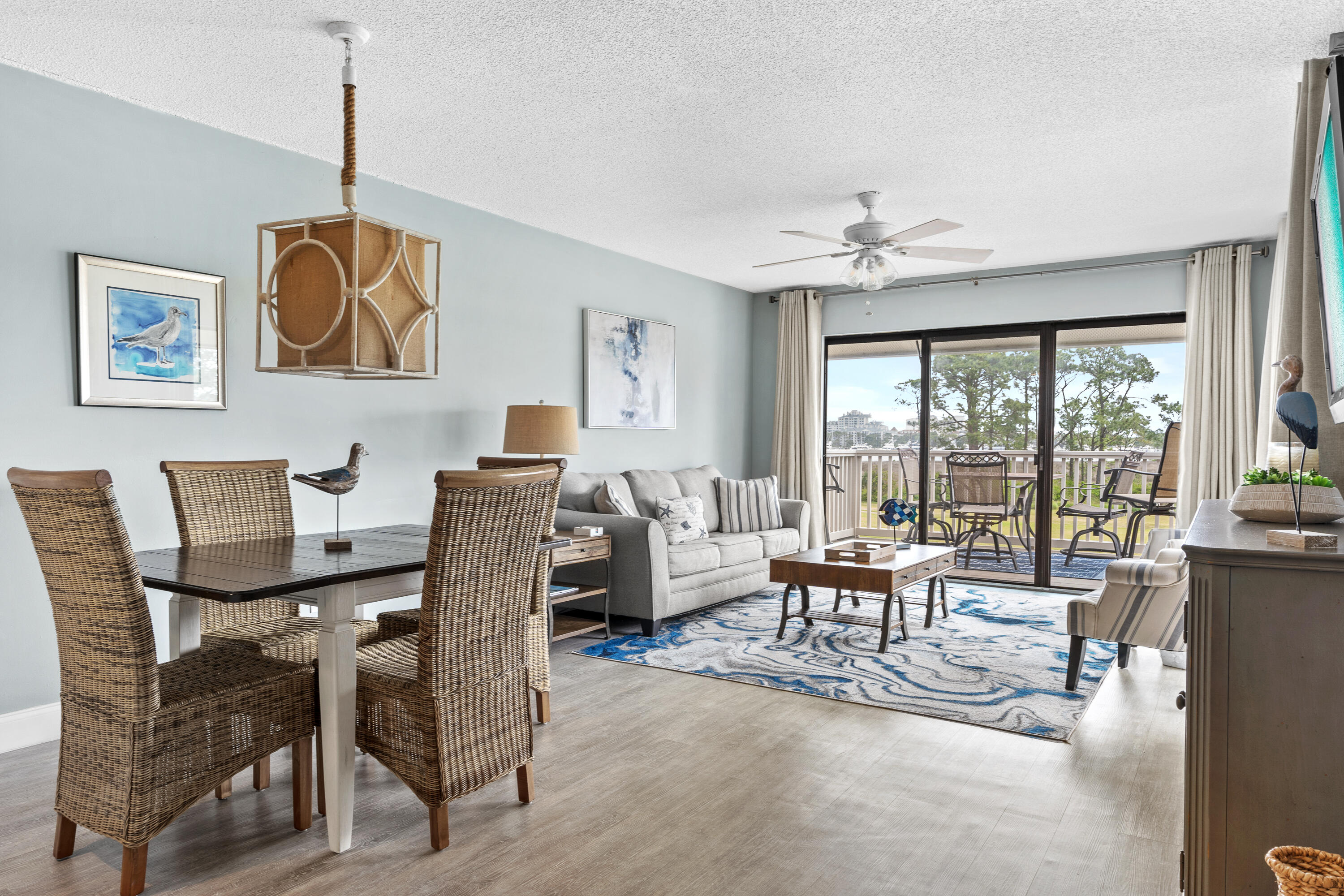 a dining room with furniture a chandelier and window