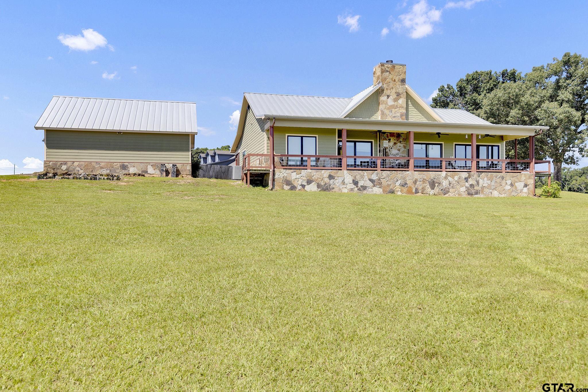 a front view of a house with swimming pool