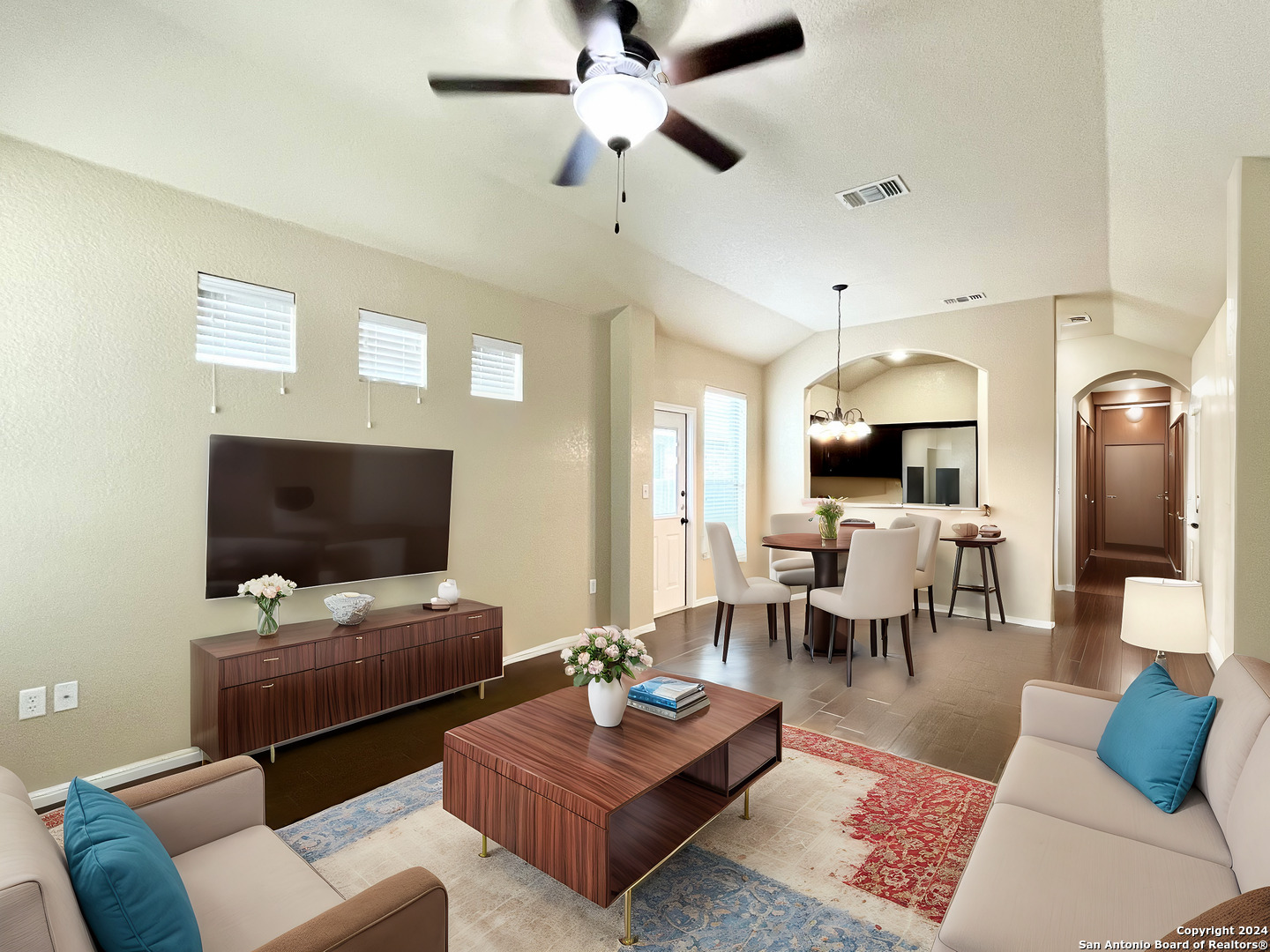 a living room with furniture and a flat screen tv