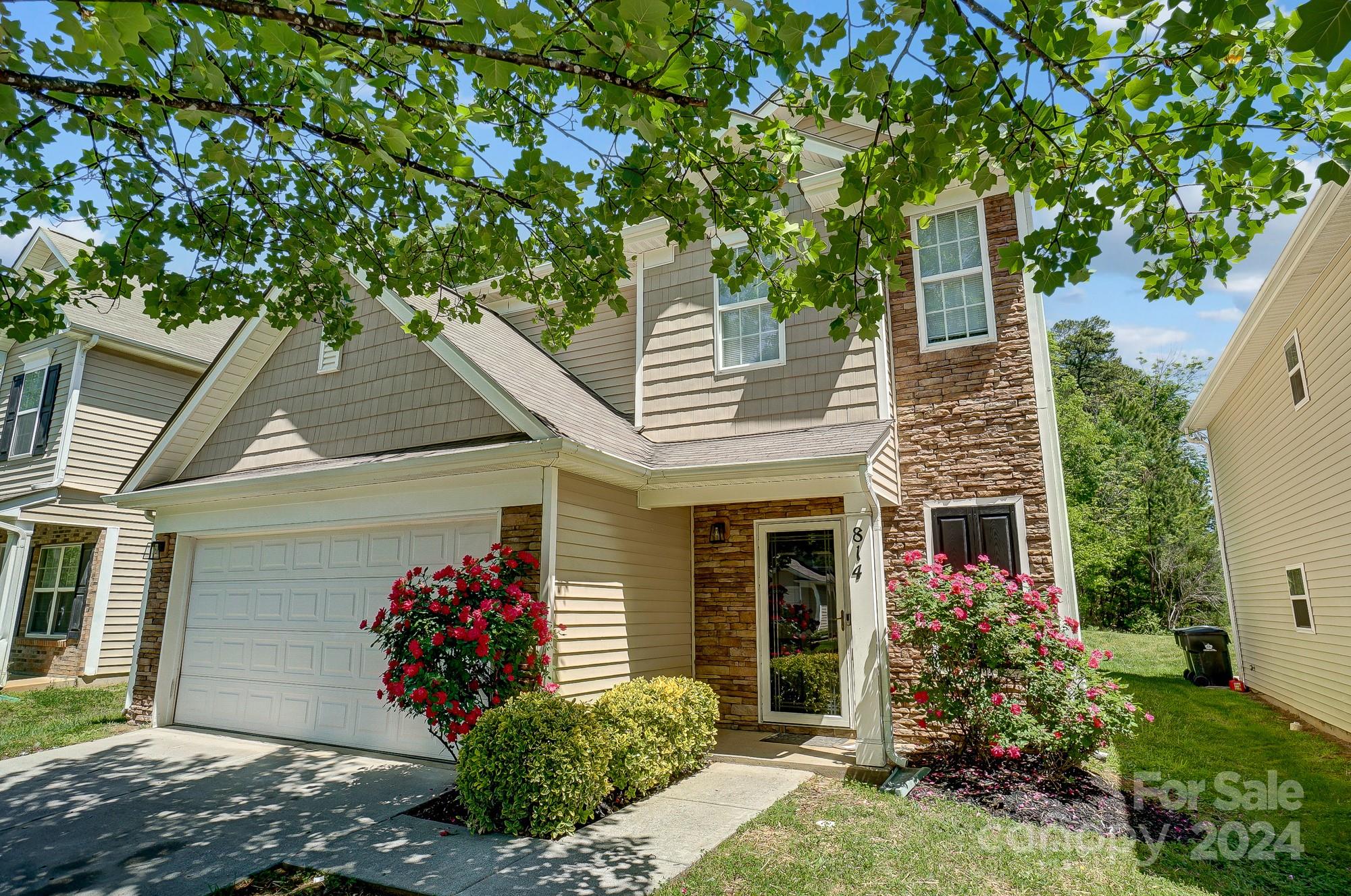 front view of a house with a yard