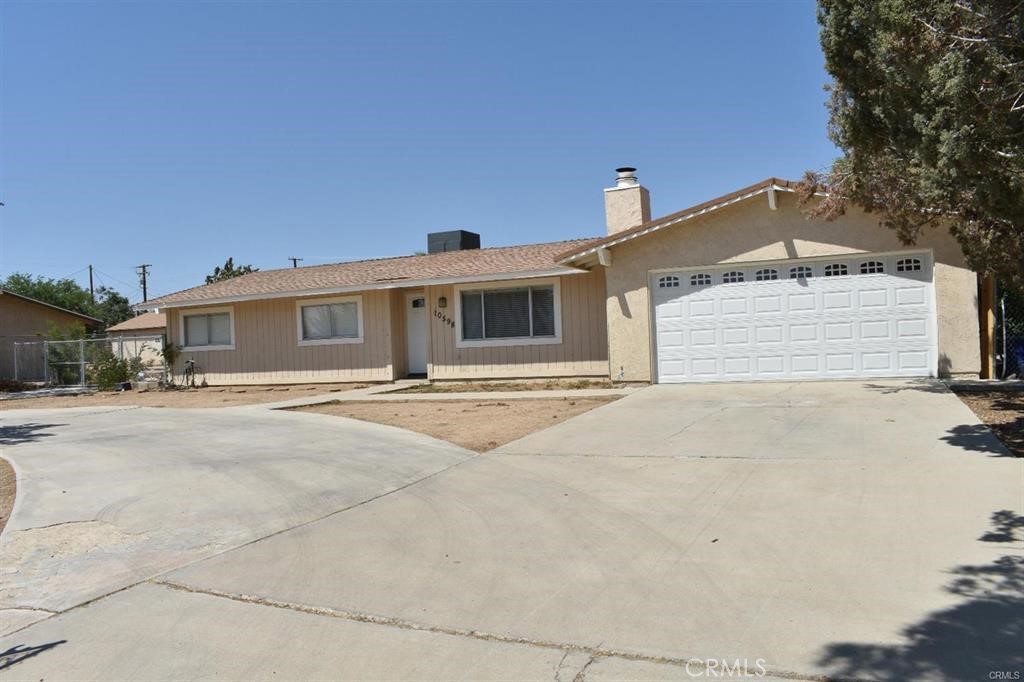 a front view of a house with a garage