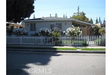 a view of a house with backyard and deck