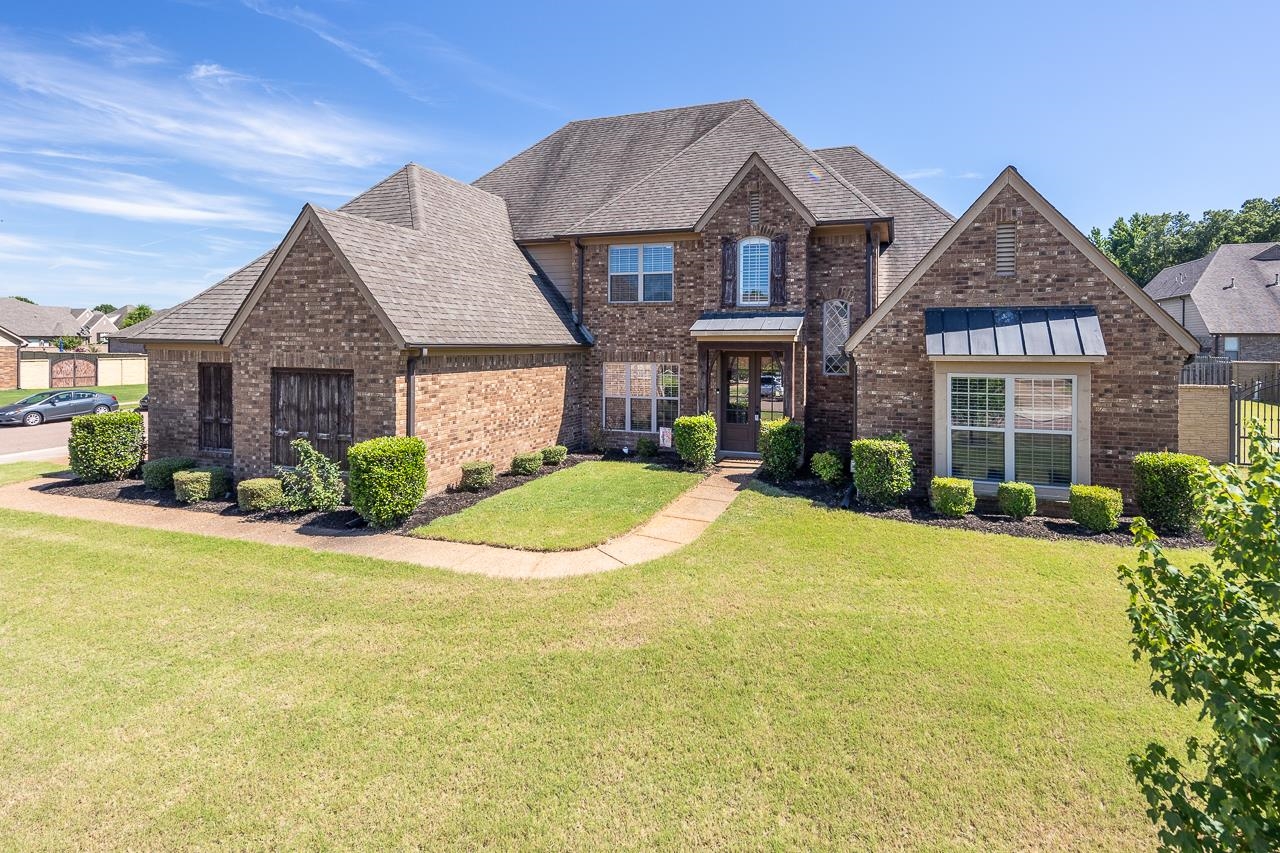 front view of a house with a yard