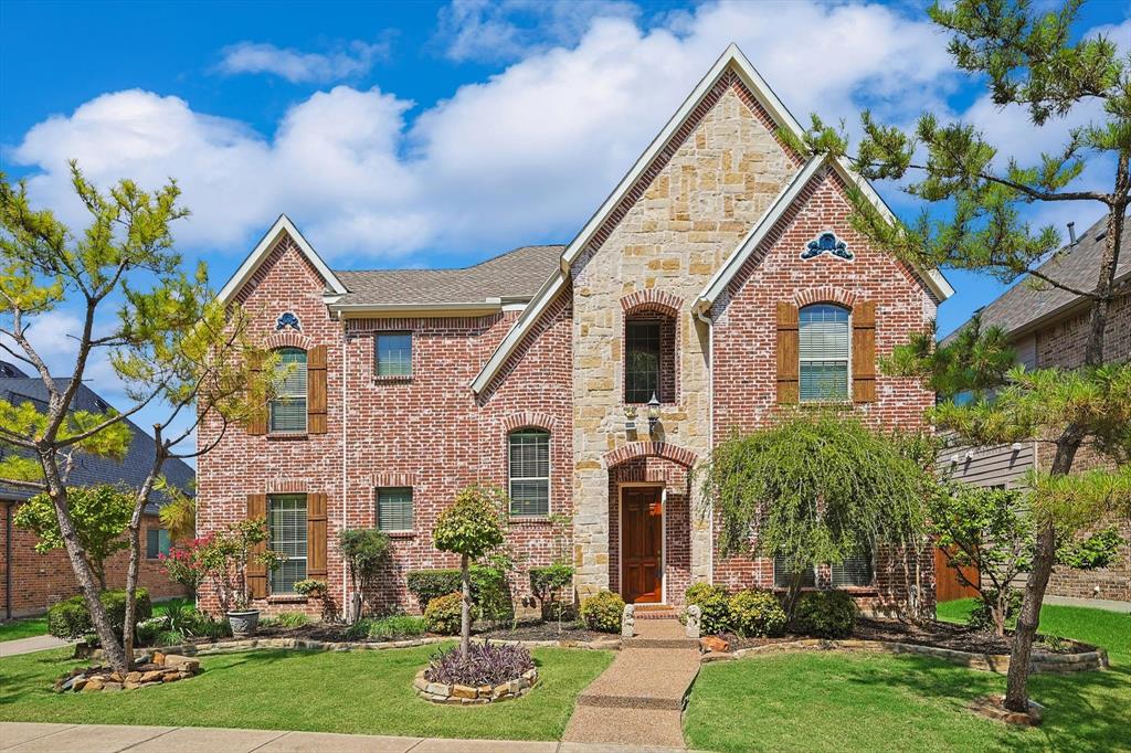 front view of a house with a yard