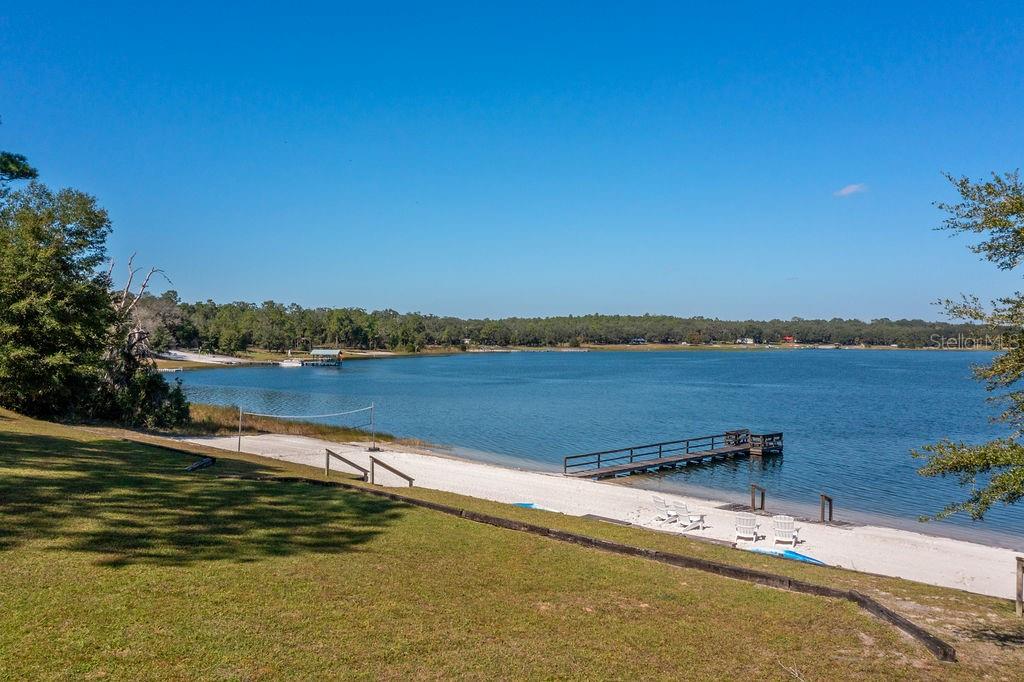 a view of a lake with houses in the back