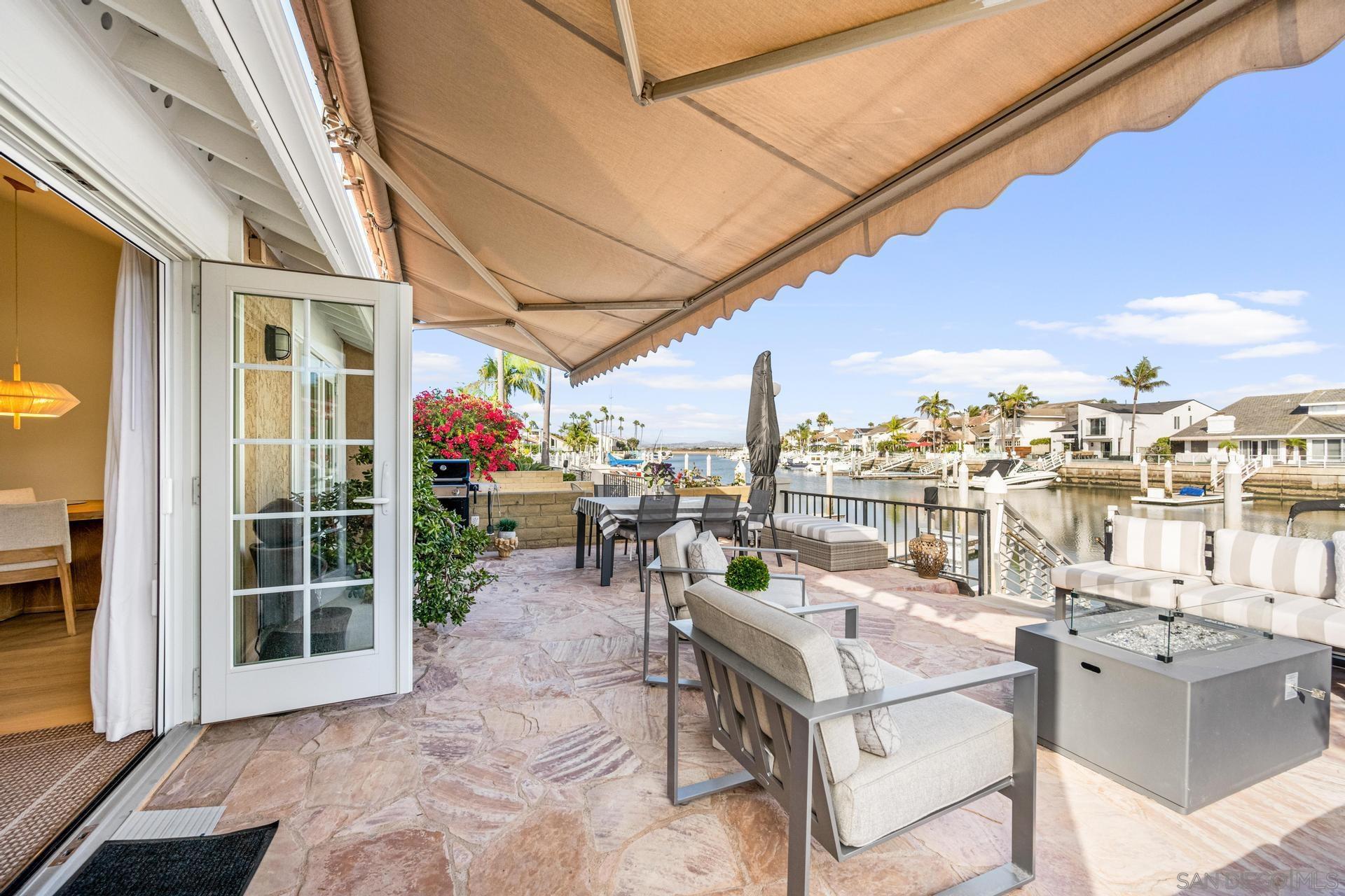 a view of a patio with a dining table and chairs