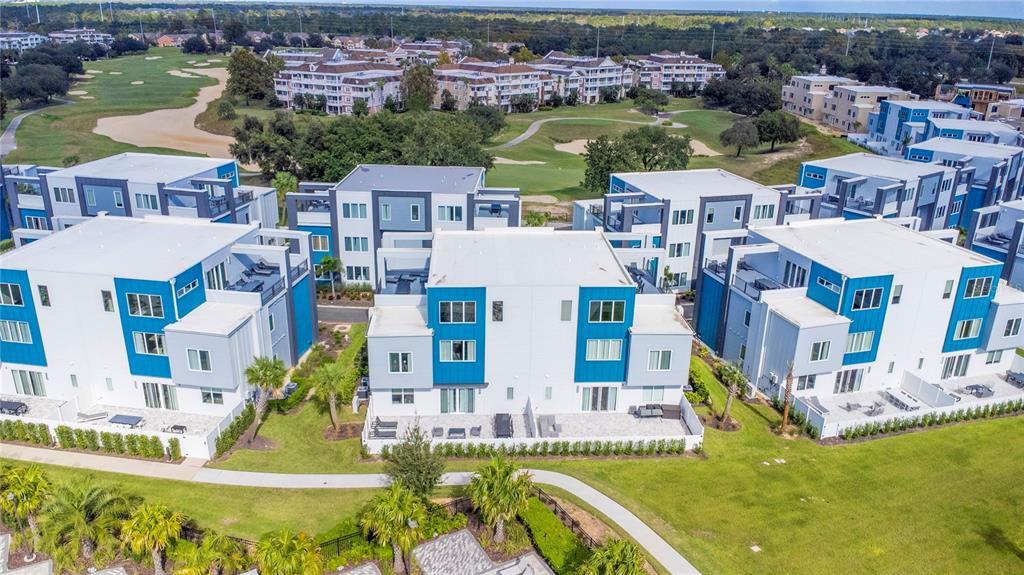 a view of building with outdoor space and swimming pool