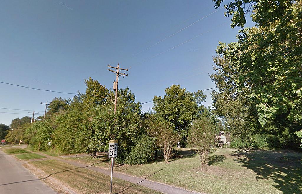 a view of a street with some trees