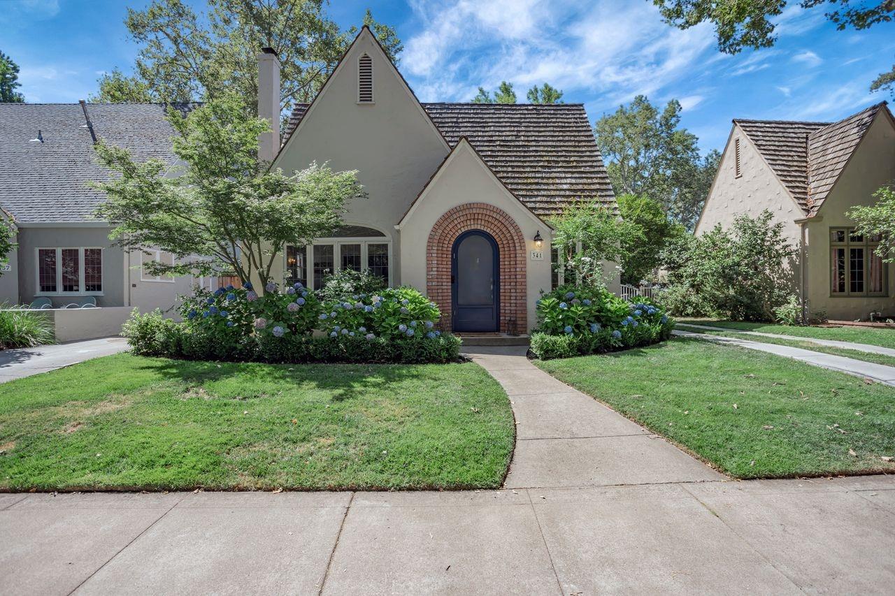 a front view of a house with garden