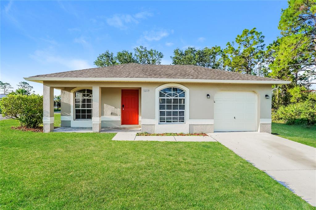 front view of a house with a yard