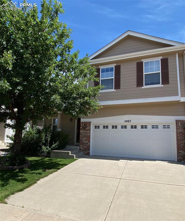 View of front of home with a garage