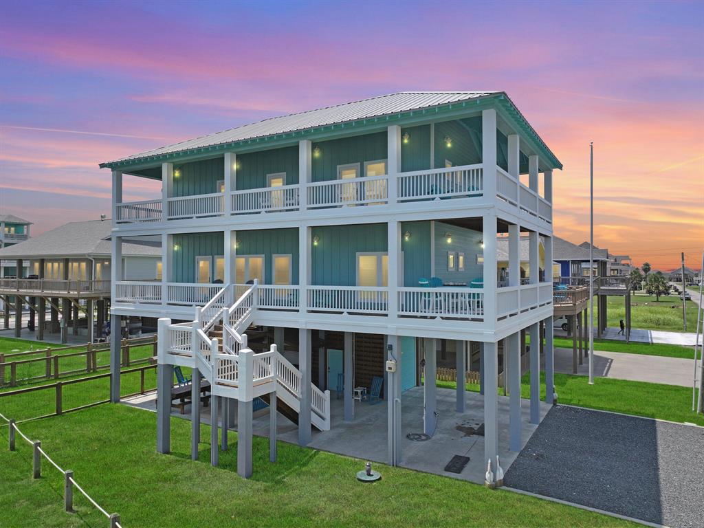 a front view of a house with a yard table and chairs