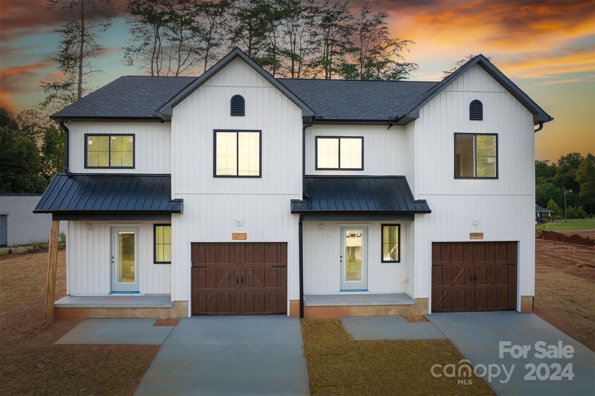 a front view of a house with a garage