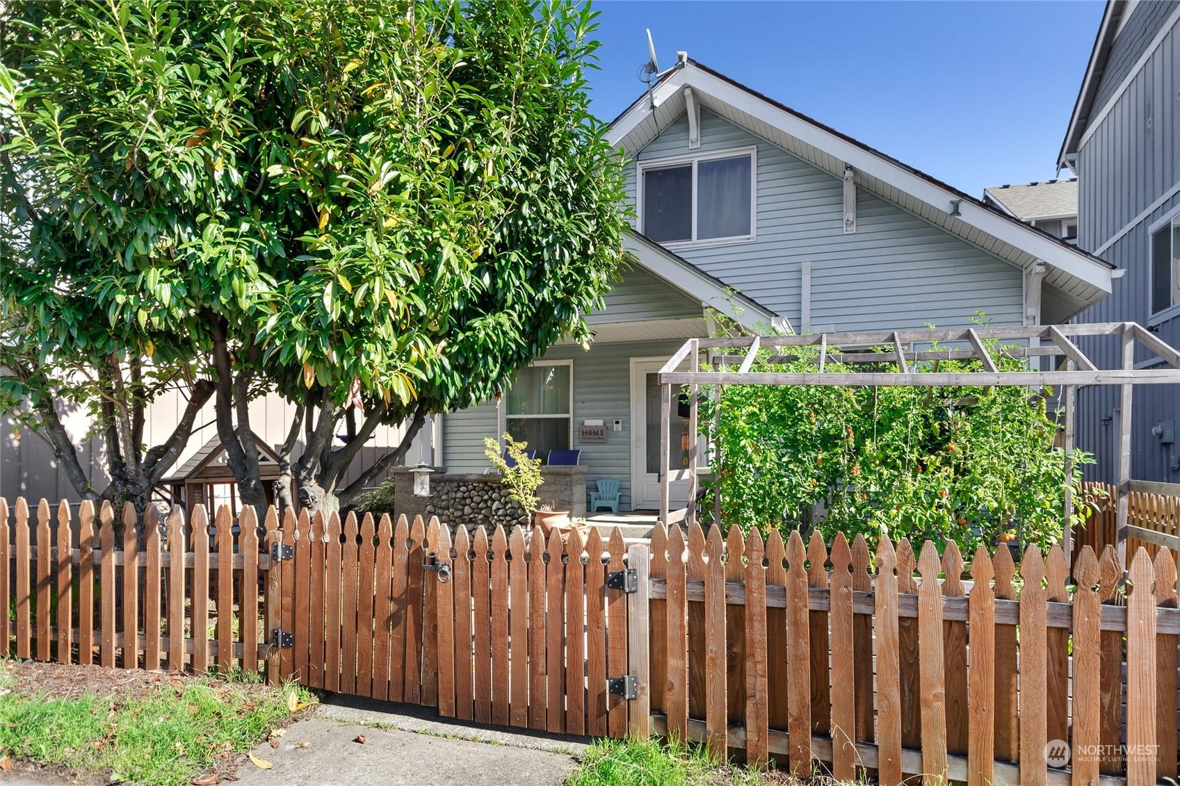 a house that has a tree in front of it