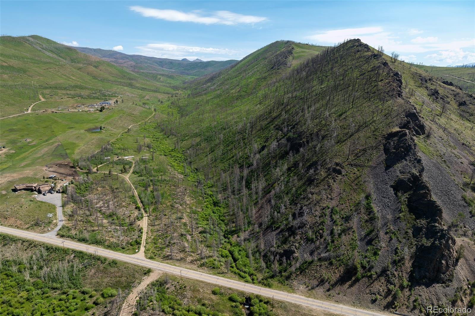 a view of a field of mountains and valleys