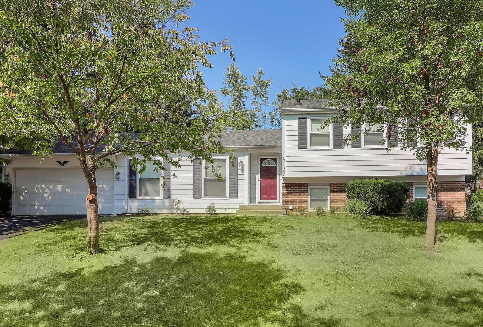 front view of a house with a yard