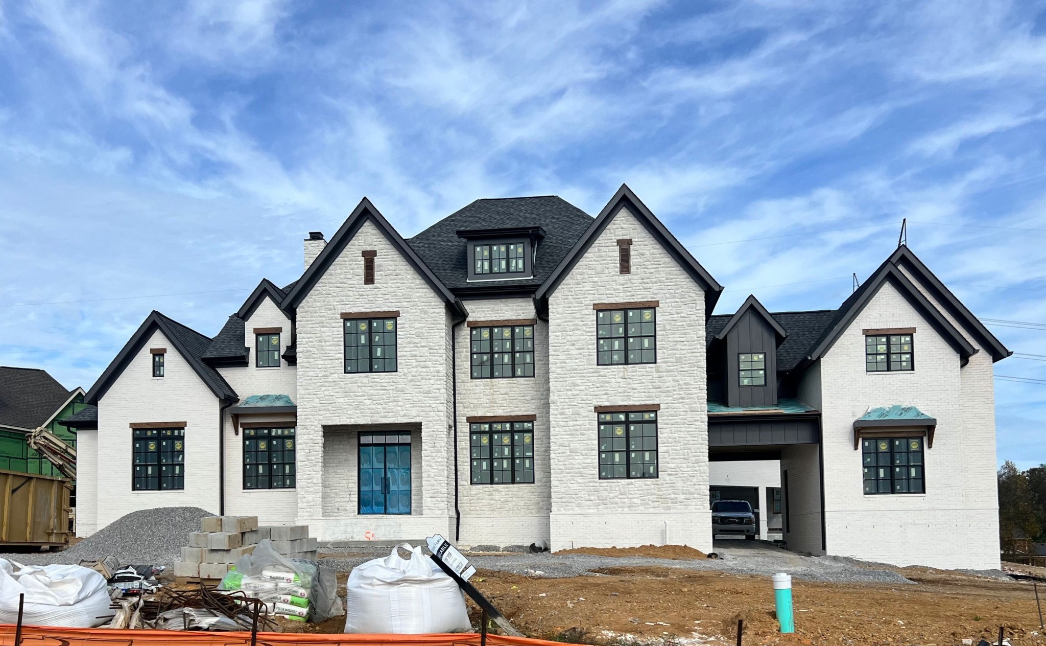 a front view of a house with parking