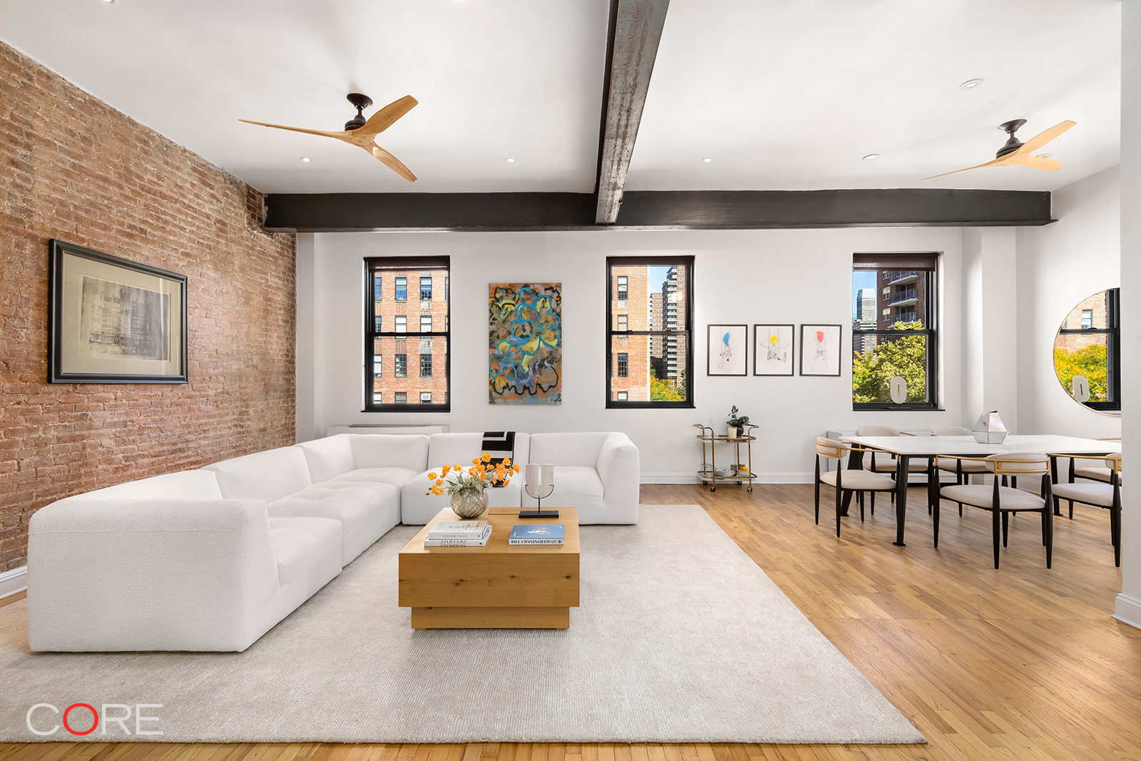 a living room with furniture and wooden floor