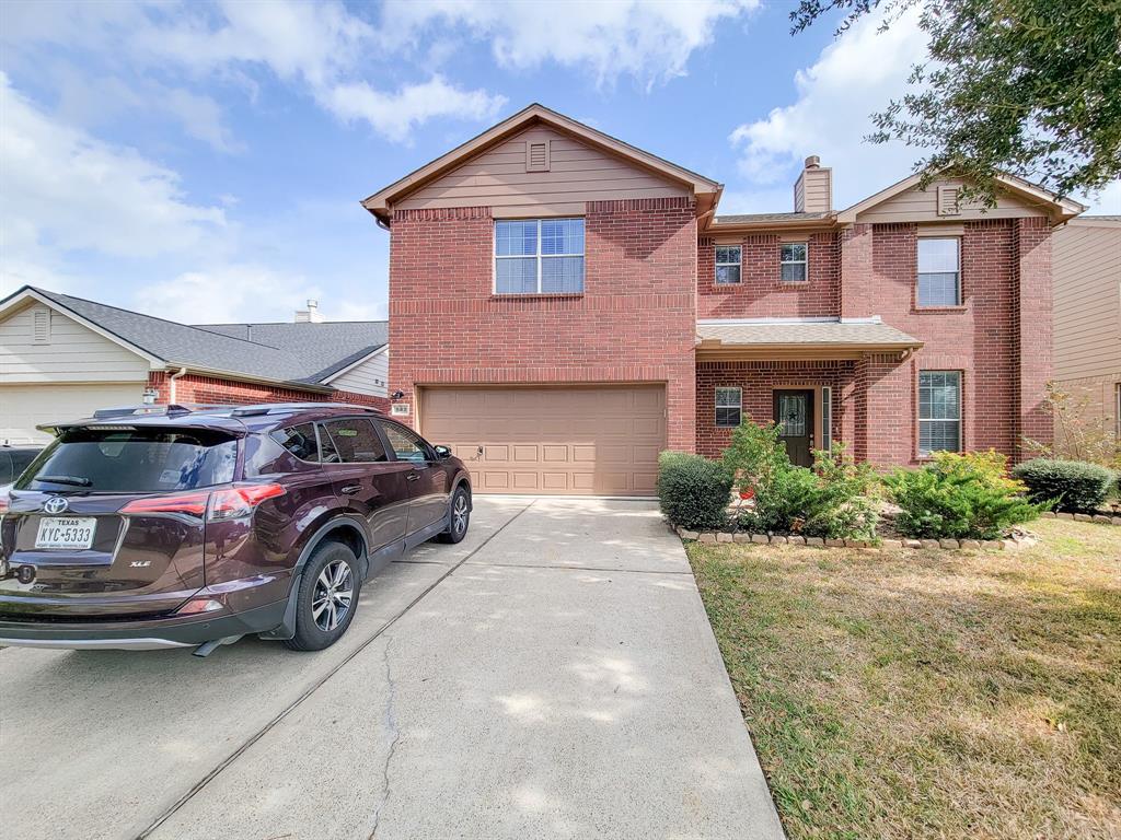 a front view of a house with parking space