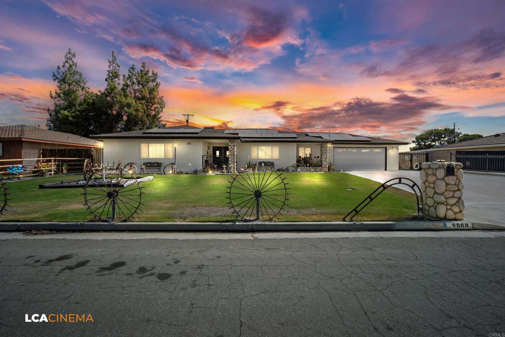 front view of a house next to a yard