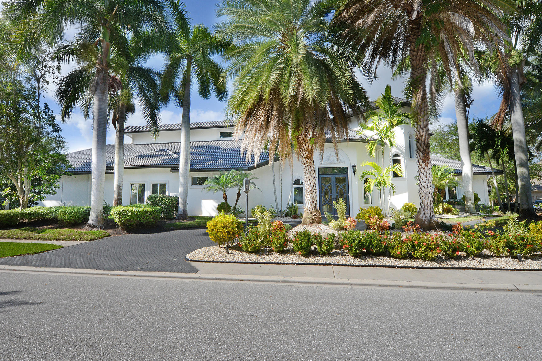 front view of a house with a garden