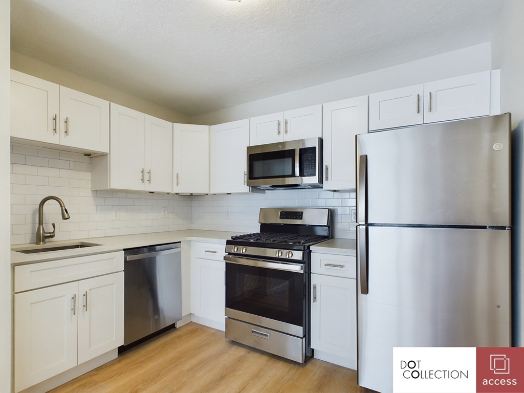 a white refrigerator freezer sitting in a kitchen