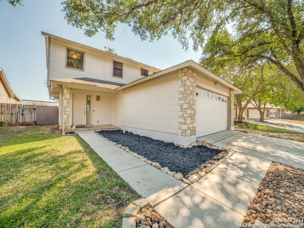 a view of a house with a yard