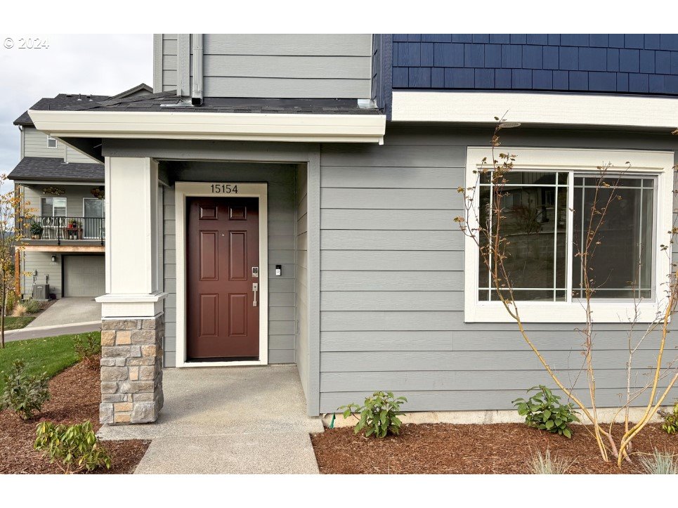 a view of a house with a door and a window