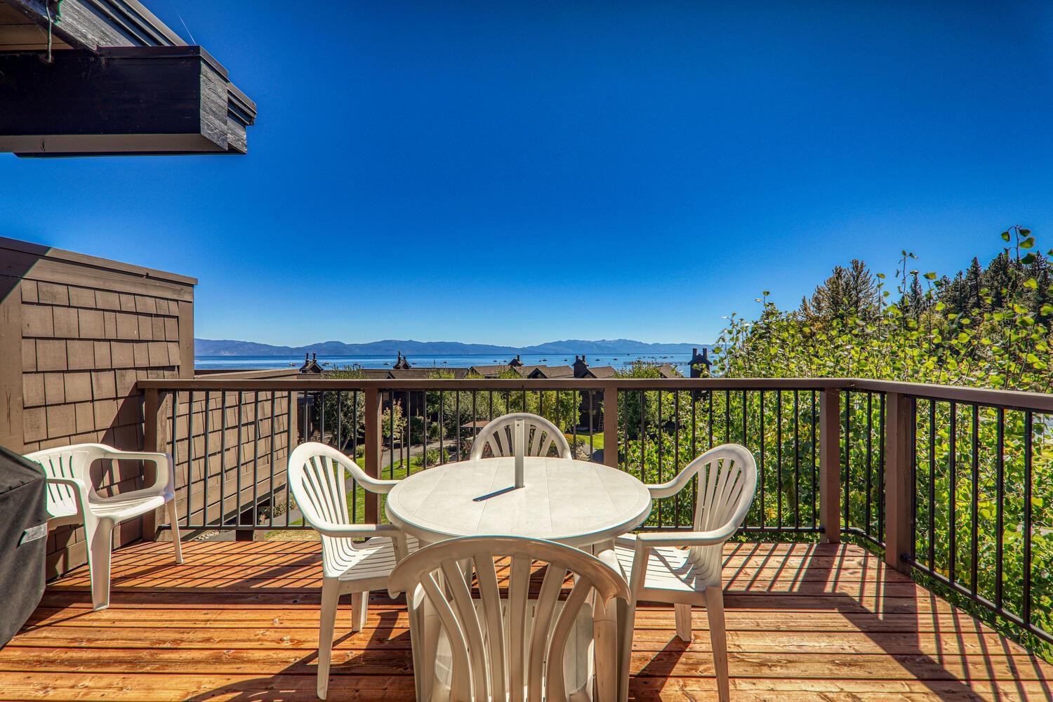 a view of a balcony with a table and chair