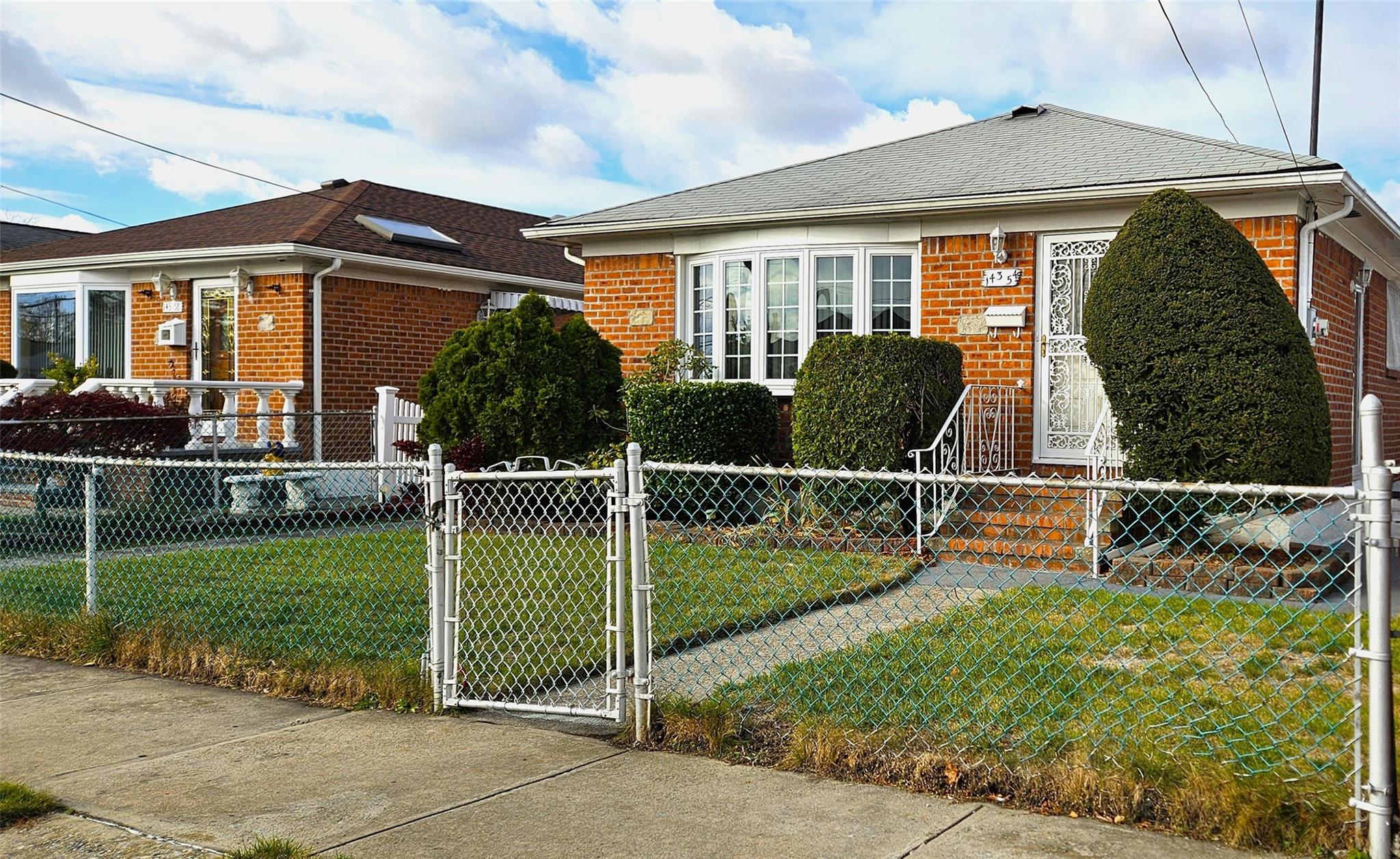 Bungalow-style house with a front yard